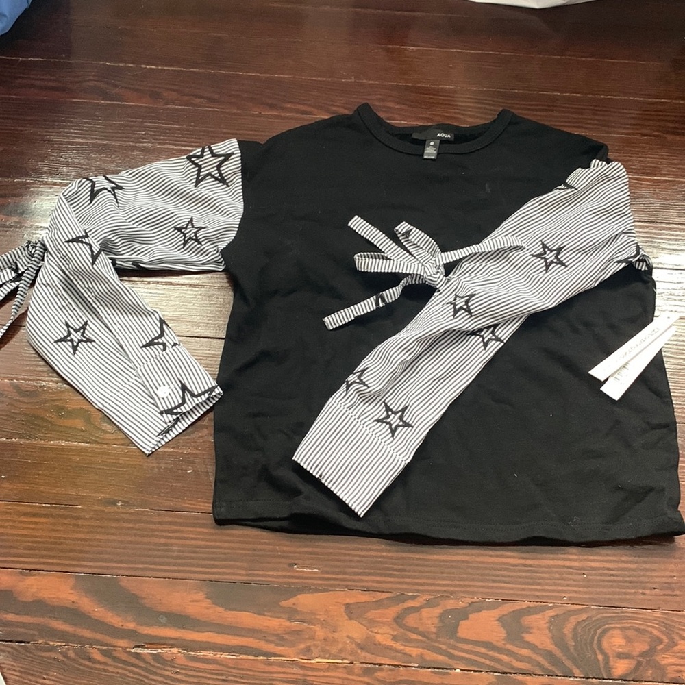 Black Aqua sweater with star sleeve detailing. Size XS. New with tags.